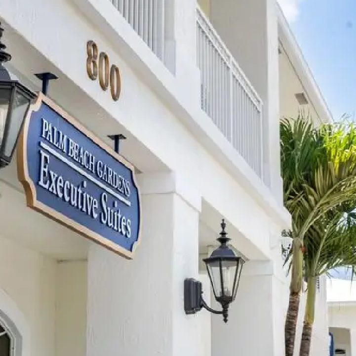 A building with a street sign on the front of it.